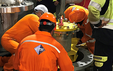 CTS team members installing sea water pump